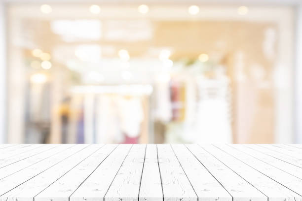 istock Perspective empty white wooden table on top over blur background, can be used mock up for montage products display or design layout. 1155352370