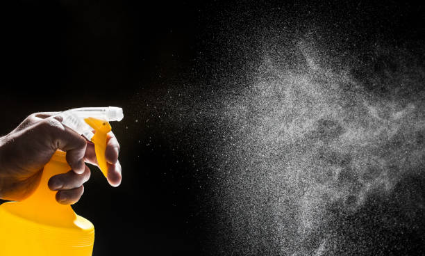 istock bottle nozzle spraying water on black background  - Image 1155356438