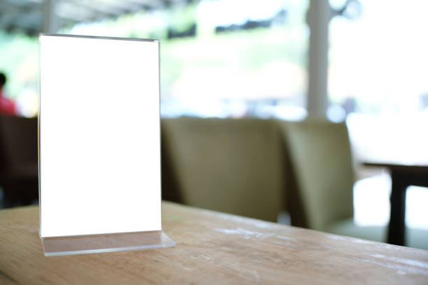 istock Menu frame standing on wood table in Bar restaurant cafe. space for text marketing promotion. 1155358315