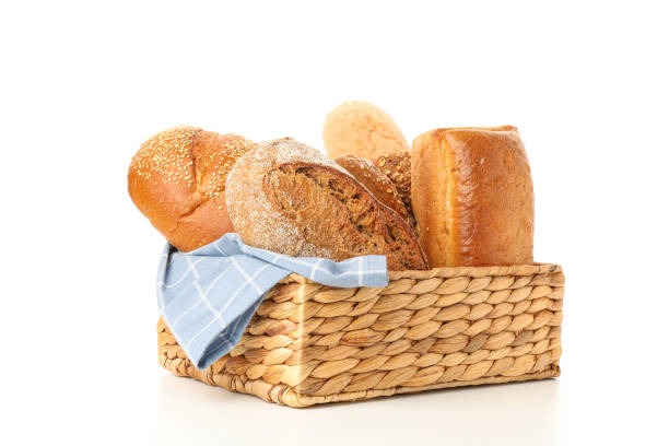 istock Bakery products in straw basket isolated on white background 1155358412