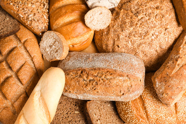istock Different bakery products as background, closeup and top view 1155358529
