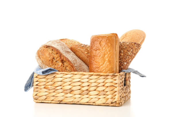 istock Bakery products in straw basket isolated on white background 1155359258