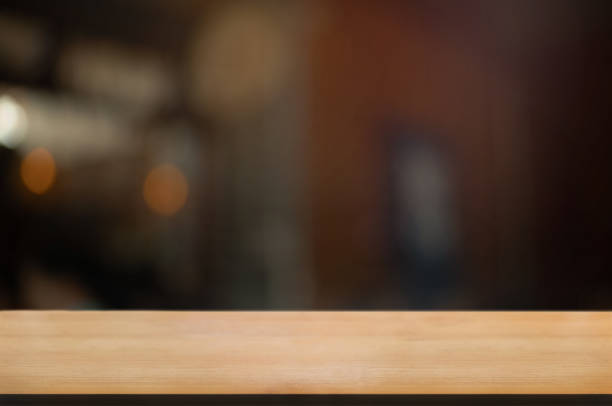 istock empty wood table with blur montage restaurant background 1155361231