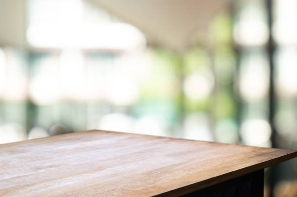 istock empty wood table with blur montage restaurant background 1155361235