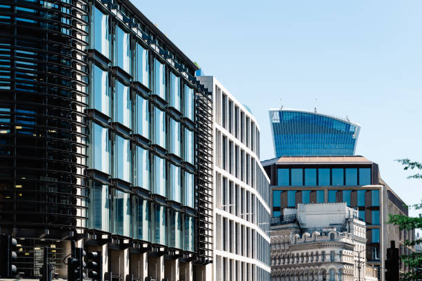 istock Low angle view of  modern office buildings in London 1155361828