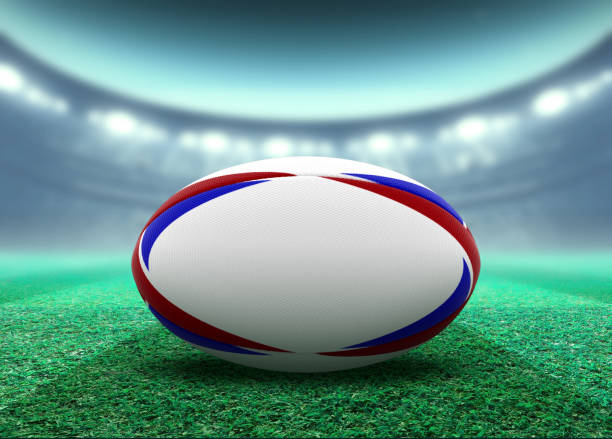 istock Floodlit Stadium And Rugby Ball 1155362458
