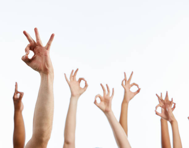 istock Raised hands making enthusiastic OK signals against white 1155363933