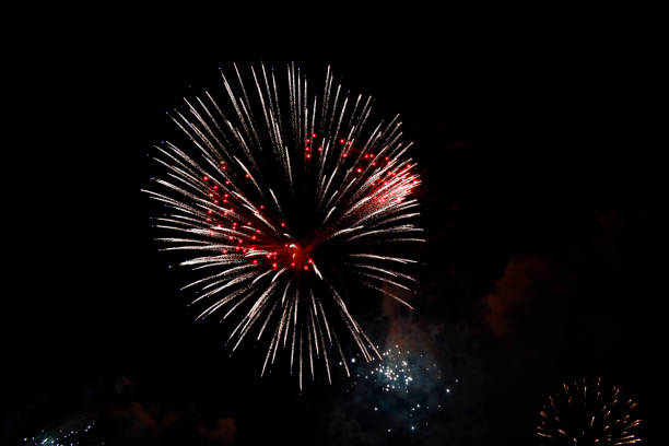 istock Celebration firework flashing in the black night sky 1155365815