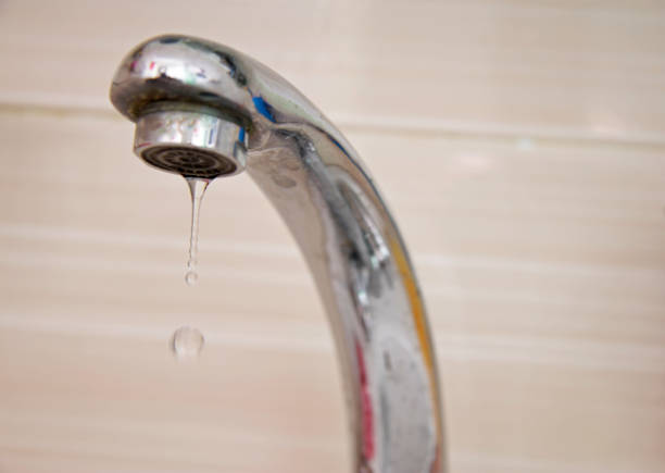 istock Drops of water falling down from the crane 1155365879