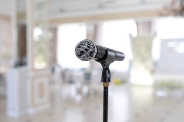 istock Microphone on the stand. Place to speak at the event. 1155365990