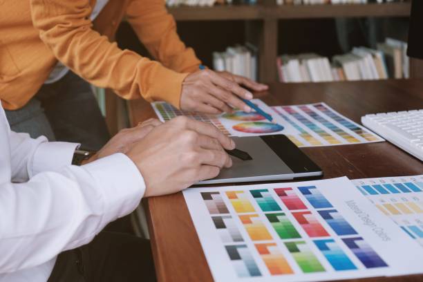 istock Graphic designer working on digital tablet. artist drawing on graphic tablet and Color swatch samples. 1155366025