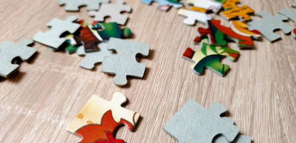 istock Puzzle on the table. Puzzle for children in the close-up 1155367215