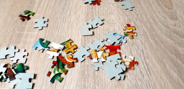 istock Puzzle on the table. Puzzle for children in the close-up 1155367237