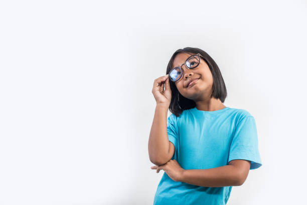 Little girl thinking in studio shot