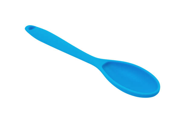 istock Blue rubber or silicone spoon with plastic handle for confectionery isolated on white background 1155370847