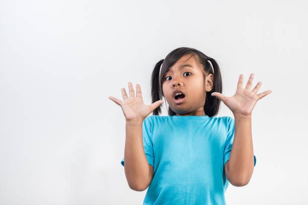 istock little girl acting Shout in studio shot 1155372303