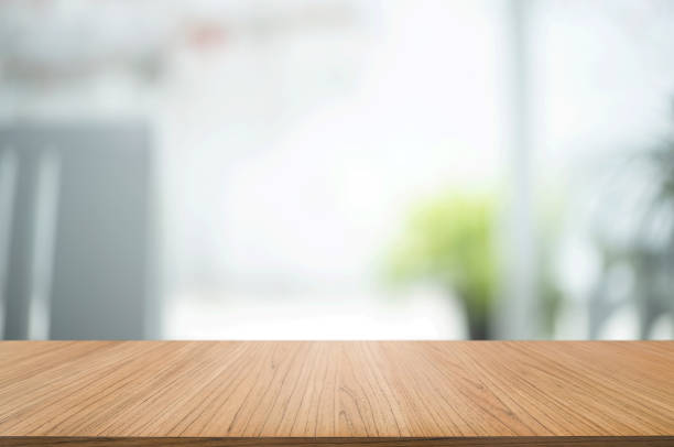 istock empty wood table with blur montage coffee shop or restaurant background. 1155372308