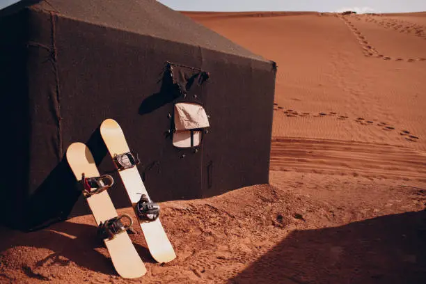 Snowboard in the desert. Vacation and activity concept.