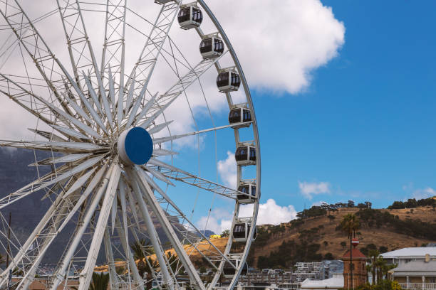 istock Ferris wheel and Table Mountain view at Waterfront in Cape Town 1155374454