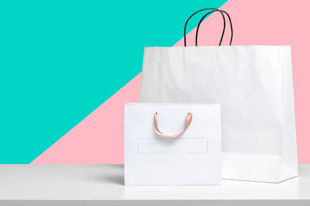 istock shopping bag on wooden table 1155374882