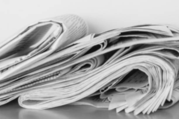 新聞クローズアップ。ニュースのコンセプト - close up newspaper folded document ストックフォトと画像