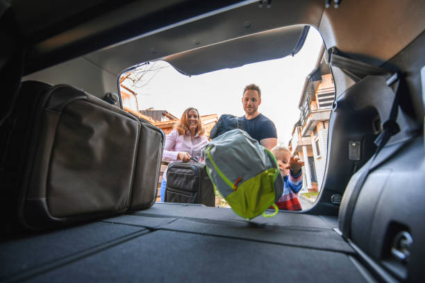 istock Family packing into a car trunk 1155375922