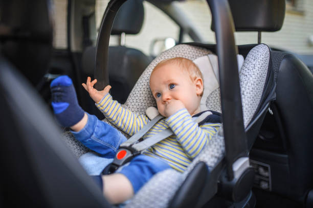 istock Baby boy in a car safety seat 1155375930