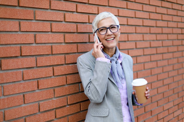 istock Grey-haired lady outdoors 1155377726