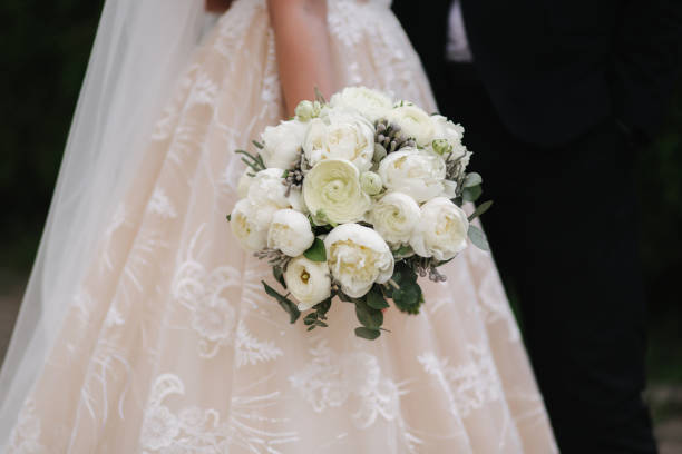 istock Closeup of bride hold bouquet in her hands 1155377846