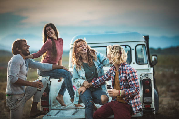 istock Young happy couples having fun on pick-up truck in nature. 1155378832