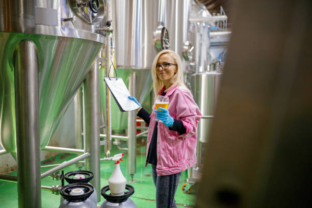 istock Woman checking production procedure on checklist 1155380229