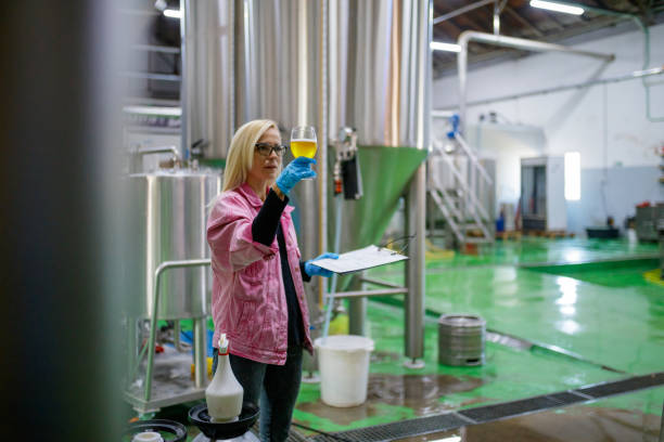 istock Brewer checking clearness of beer 1155380234