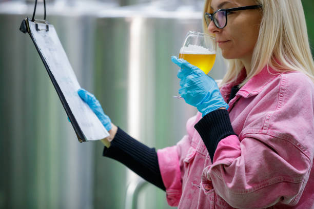 istock Looking at checklist and smelling lager in glass 1155381049