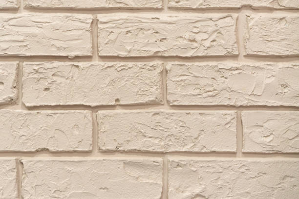 istock beige block brick wall Beautifully arranged texture background 1155381975