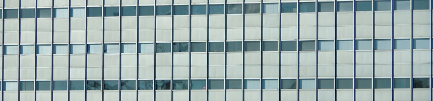 Photo of a detail of a modern building. Windows of glass