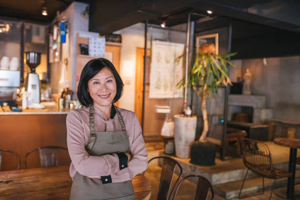 istock Senior Cafe owner standing with crossed arms 1155392201