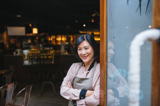 istock Senior Cafe owner standing with crossed arms 1155392251
