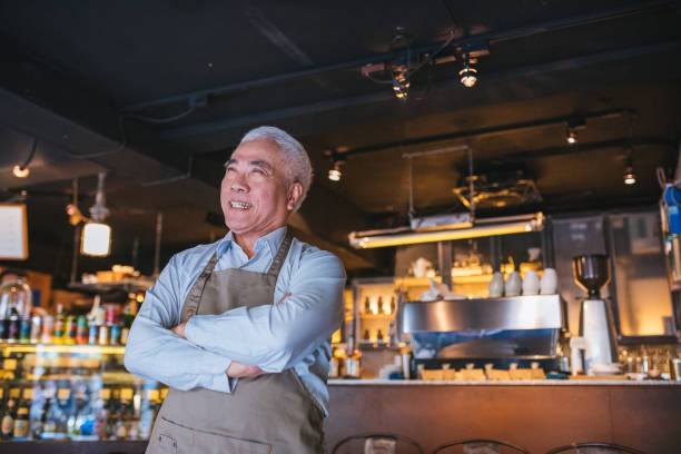 istock Senior Cafe owner standing with crossed arms 1155392256