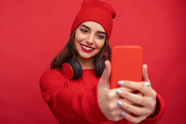 istock Contemporary bright hipster girl taking selfie 1155392726