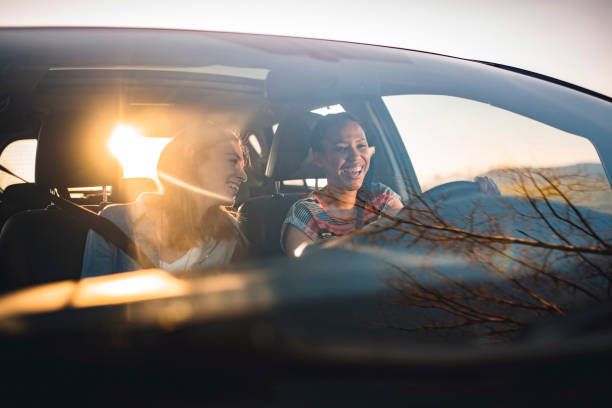friends driving in a car on a sunny day