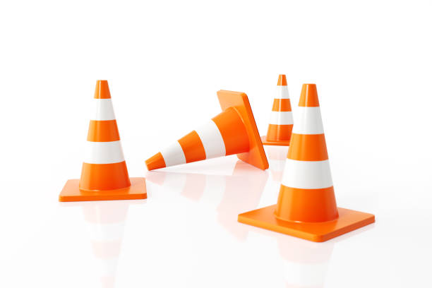 Traffic Cones On White Background Orange colored traffic cones on white background. Horizontal composition with  copy space. Clipping path is included. traffic cone photos stock pictures, royalty-free photos & images