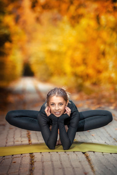 istock beautiful girl doing yoga in the fall 1155395148