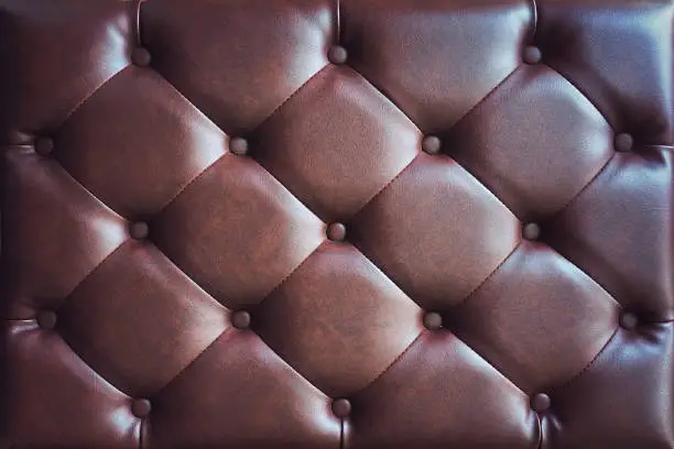 elegant brown leather sofa bed texture with buttons for pattern and background