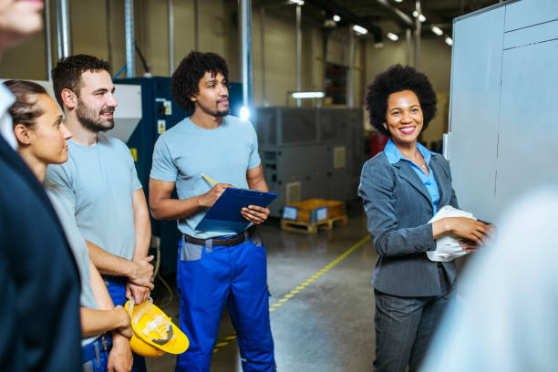 istock Managers and workers having meeting inside of factory 1155395726