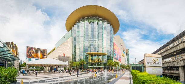 Shoppers walking through the plaza outside the Siam Paragon shopping mall in the Pathum Wan downtown district of Bangkok, Thailand’s vibrant capital city.