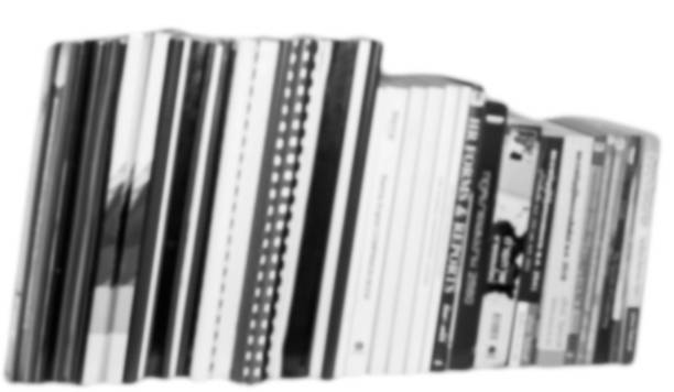 istock Bookshelves with black and white background blurred 1155399824