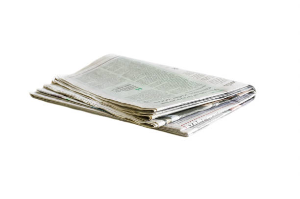 istock Newspaper folded and stacked black and white background blurred 1155399857