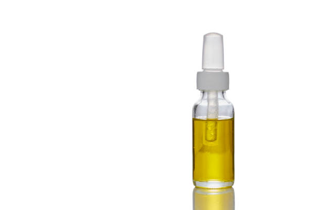 istock Medicinal cannabis with extract oil in a bottle on white background 1155402267