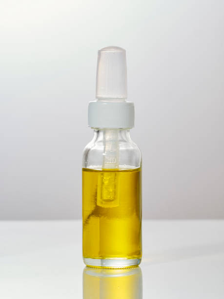 istock Medicinal cannabis with extract oil in a bottle on white background 1155402268