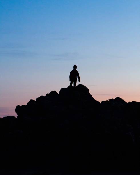 istock A lone figure utop the mountain 1155402276